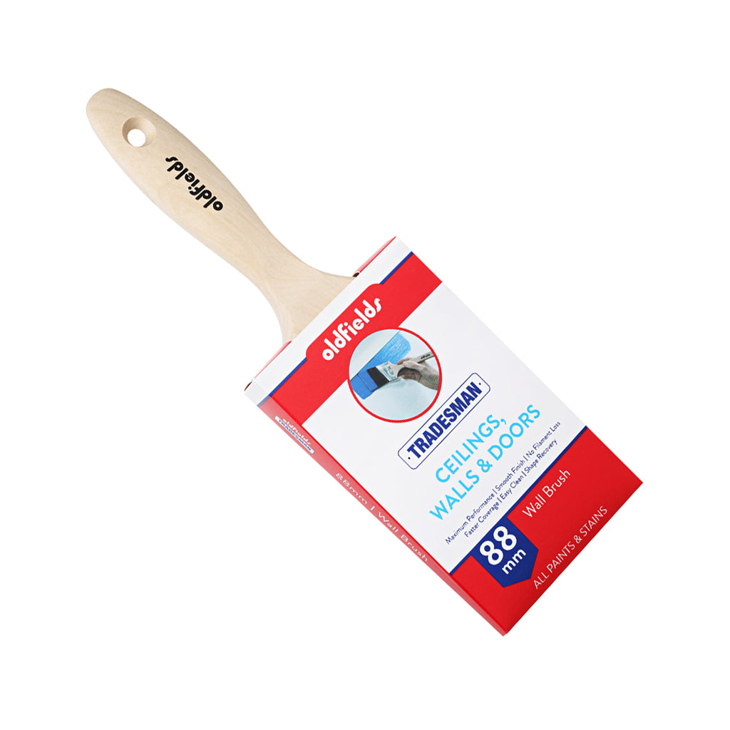 Angled view of Oldfields Tradesman 88mm professional paint brush with birch handle