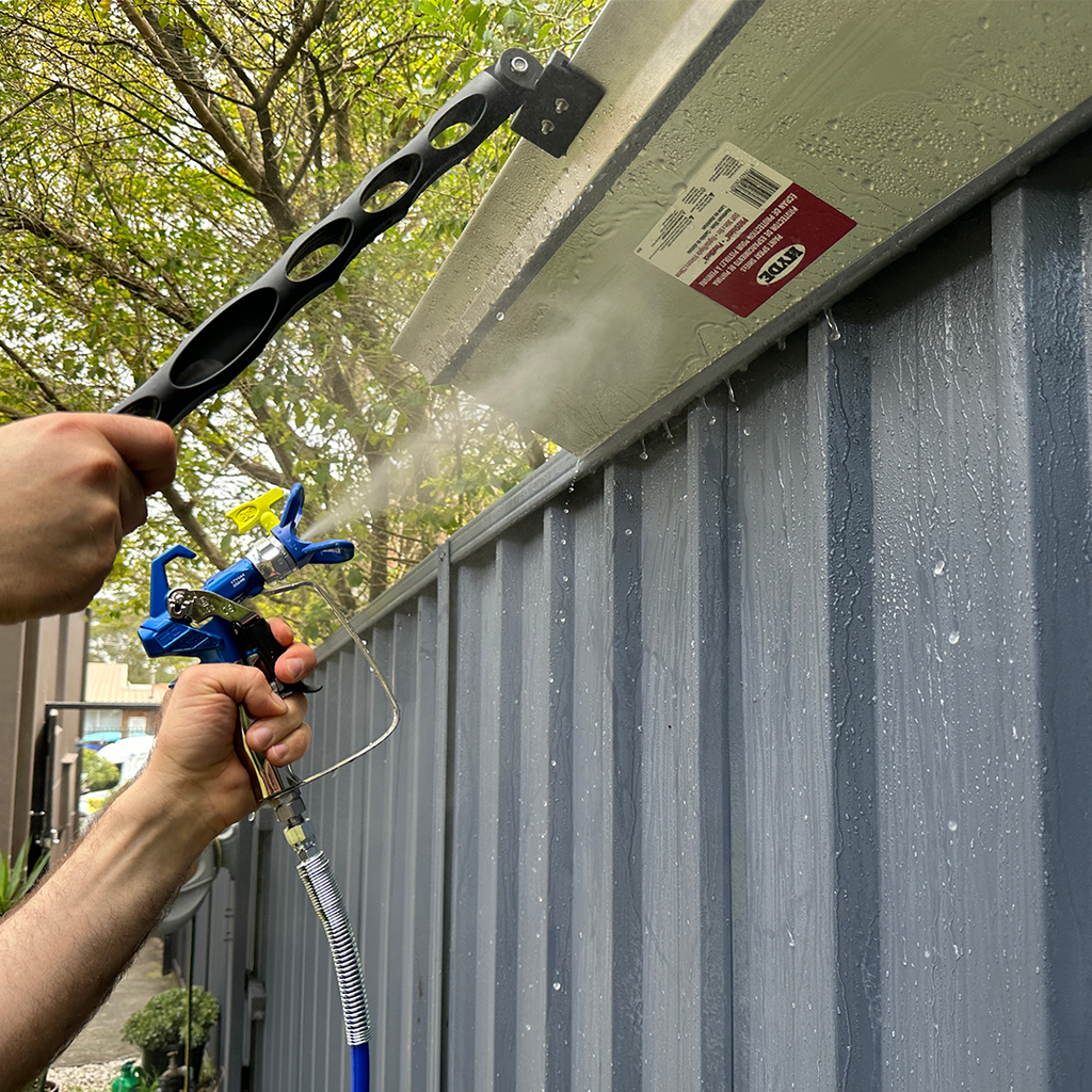 Close-up of the iQuip aluminium spray shield preventing paint overspray on timber eaves