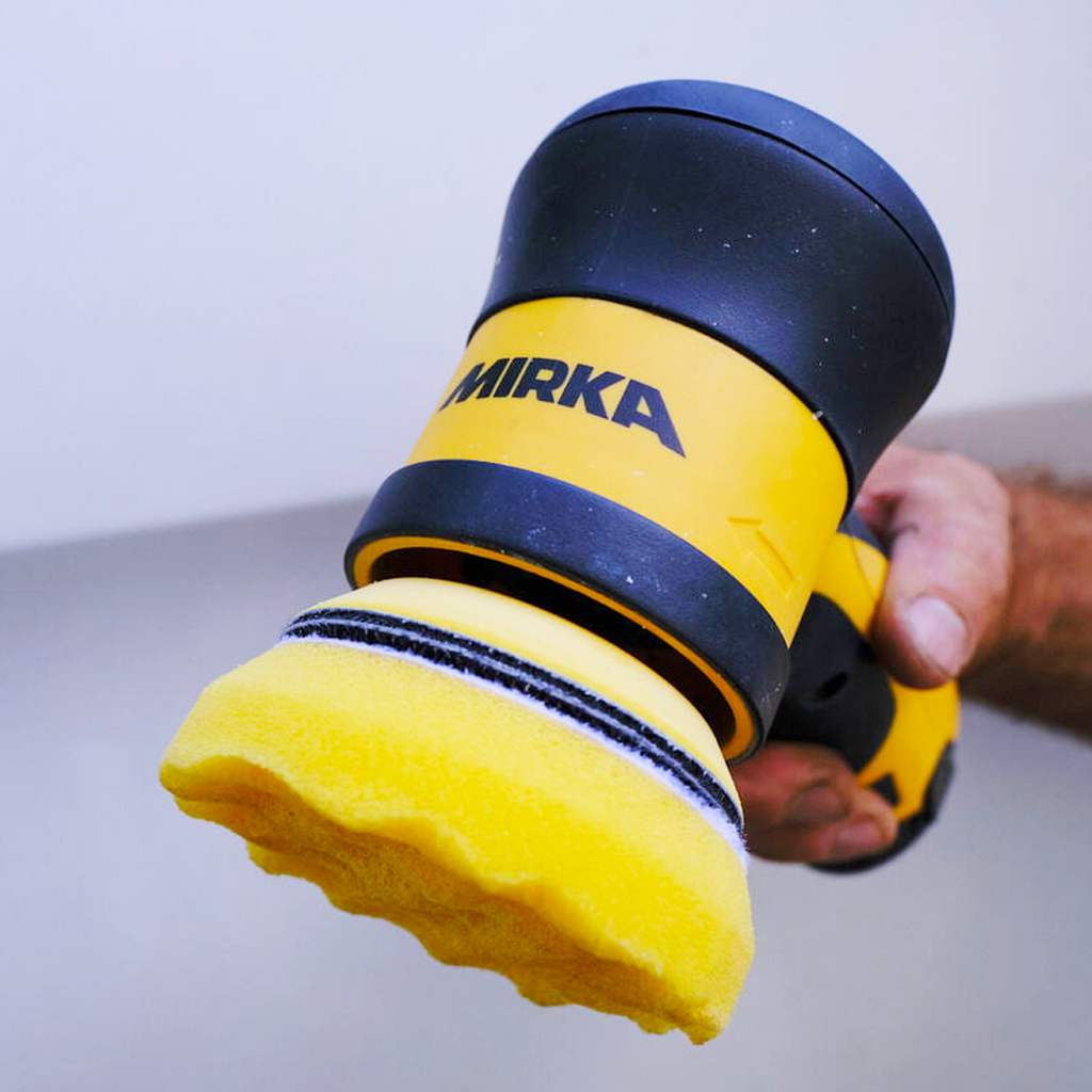 Polishing a surface with the Mirka ARP-B using a yellow foam compounding pad