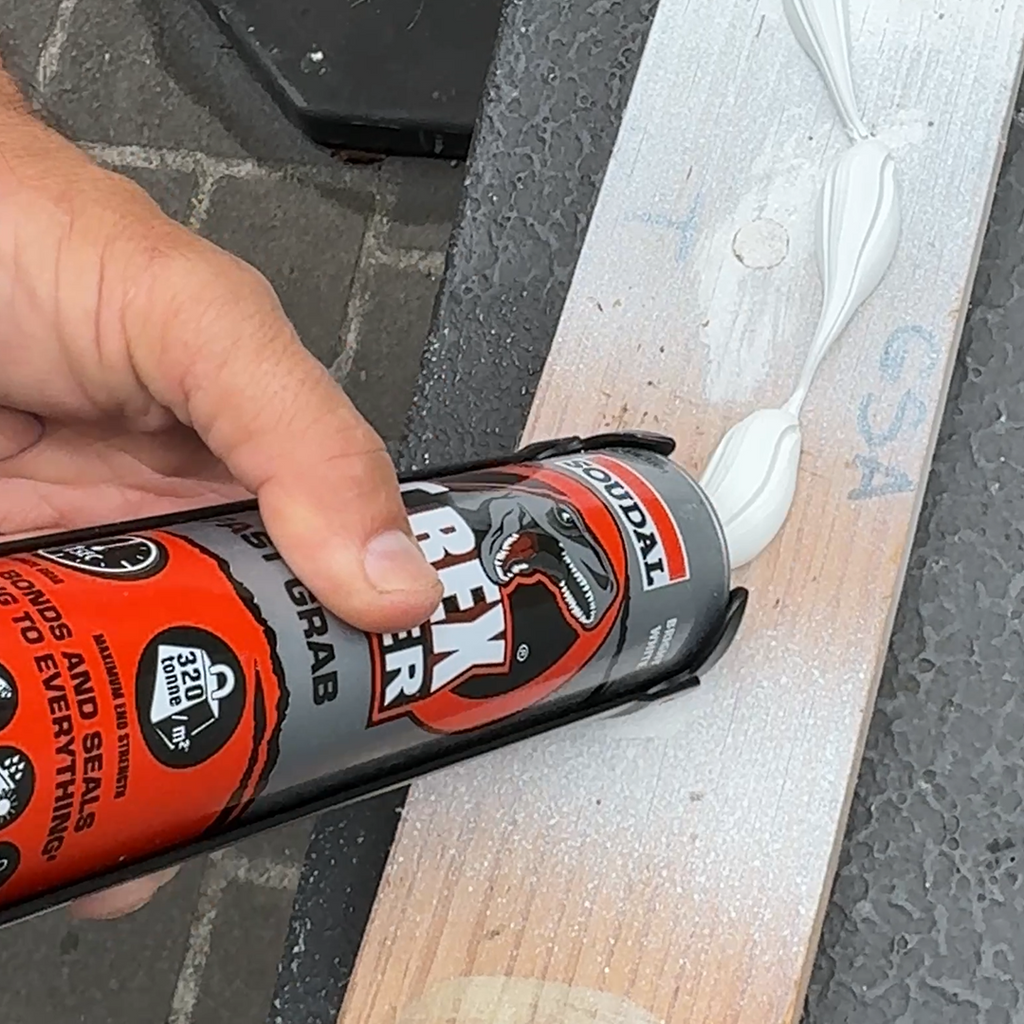 Applying Soudal T-Rex Power adhesive to a timber plank for high-strength bonding on site