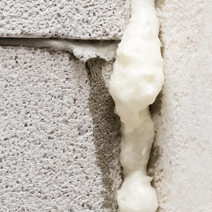 White flexible acrylic filler applied to a masonry joint for a durable weatherproof seal