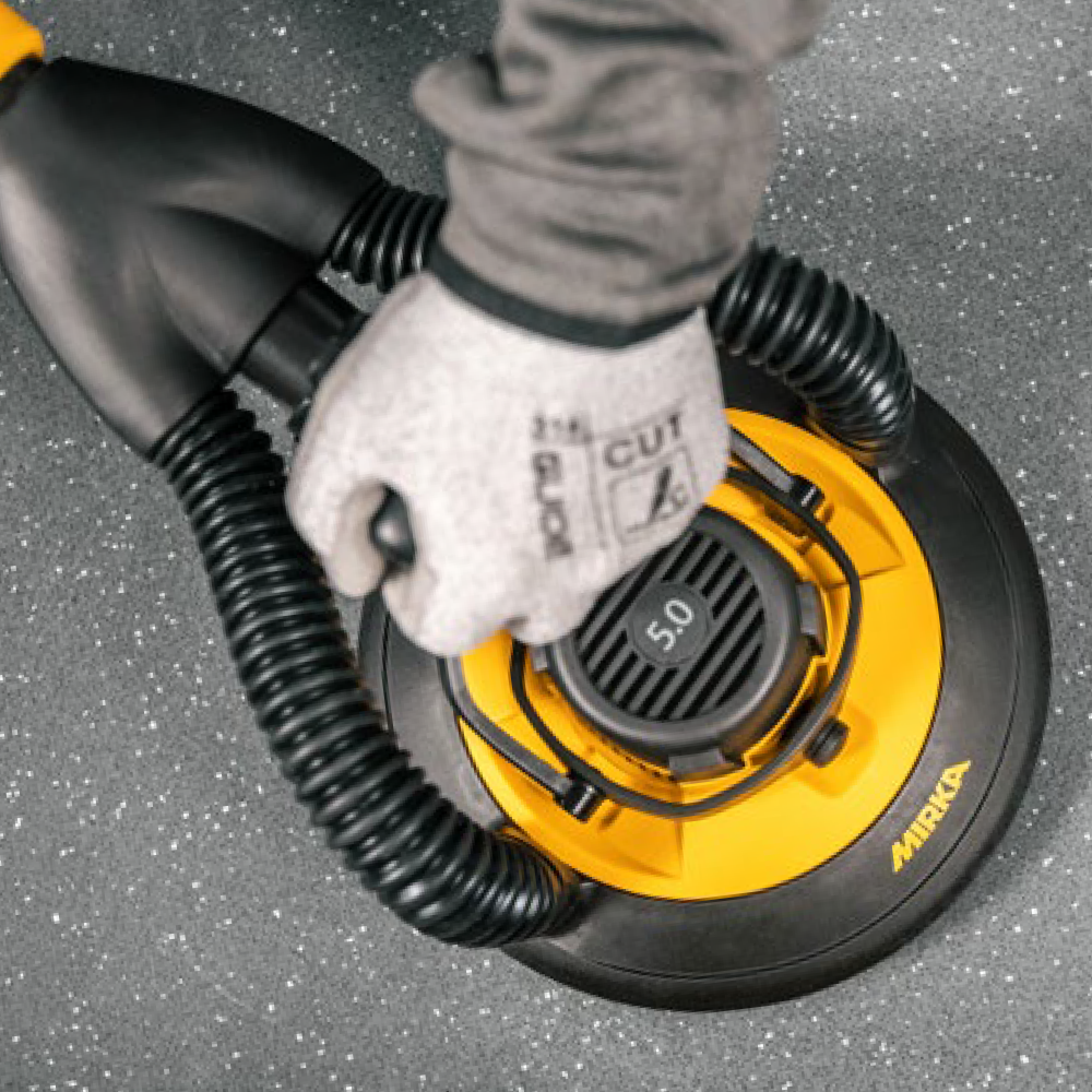 Top view of the Mirka LEROS-S 5.0mm random orbital head on a grey surface