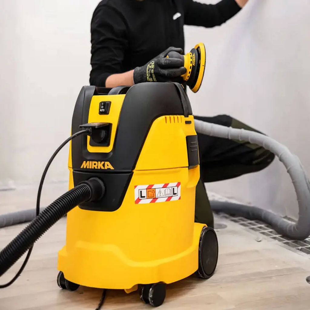 Dust-free wall sanding using Mirka orbital sander paired with 1125L PC extractor