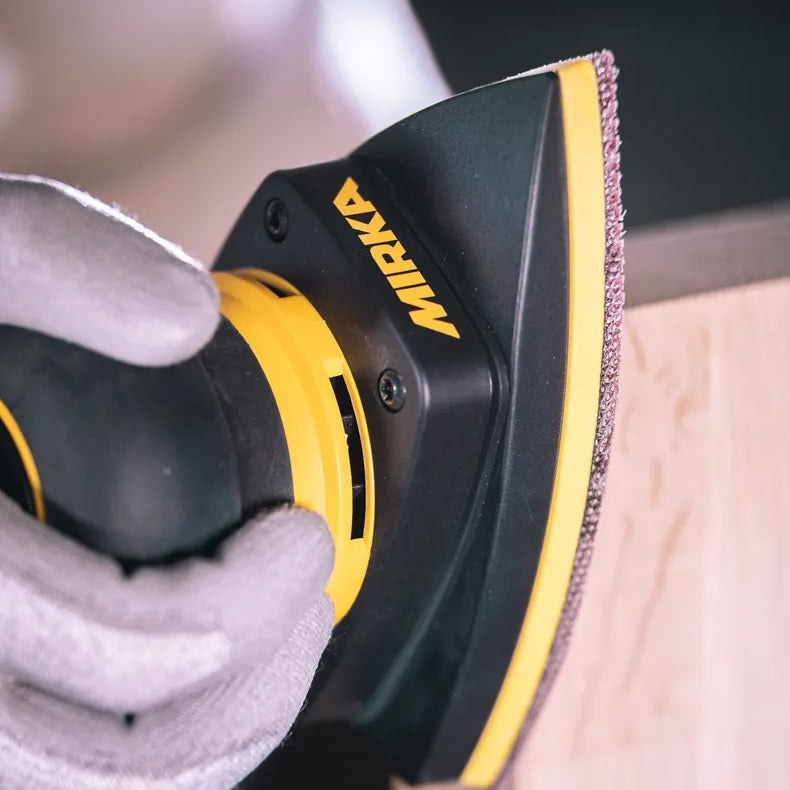 Mirka Abranet triangular mesh abrasive attached to the DEOS II Delta sanding pad