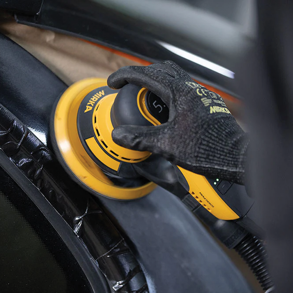 Mirka DEROS II 650CV used for precision surface preparation in an automotive workshop