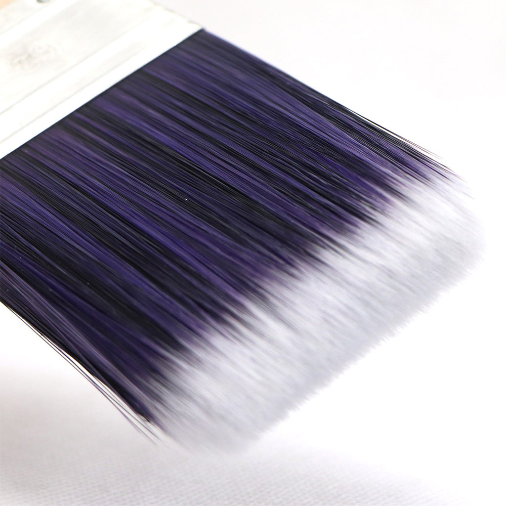 Close-up of Oldfields E4 synthetic filaments showing fine tapered white tips for flawless finish
