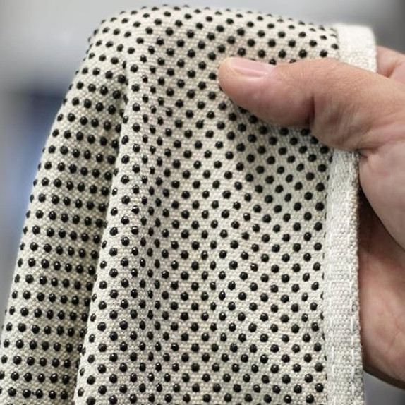 Detailed view of rubber grip dots on Oldfields 8oz heavy duty cotton canvas drop sheet